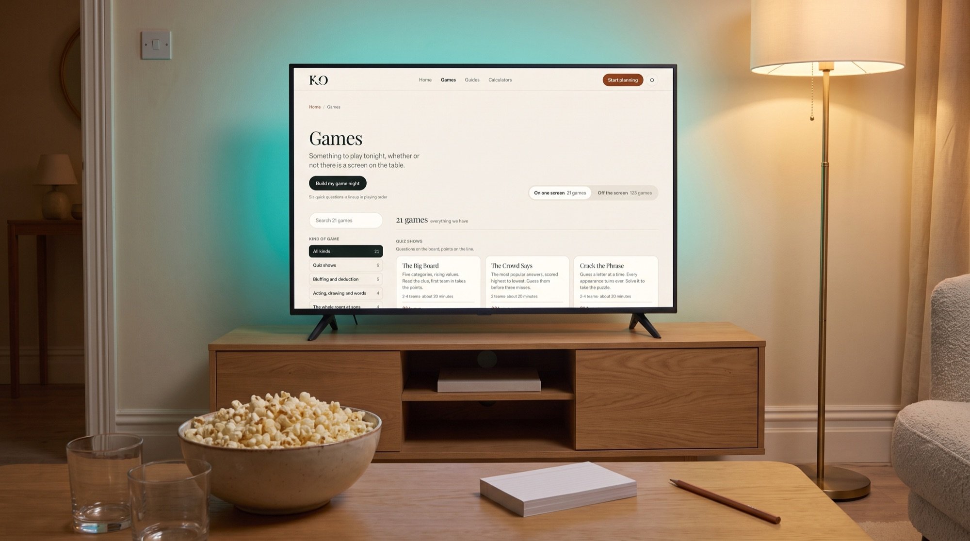 A television in a living room showing the games page